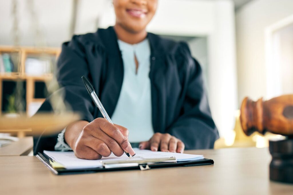 A woman signing her will