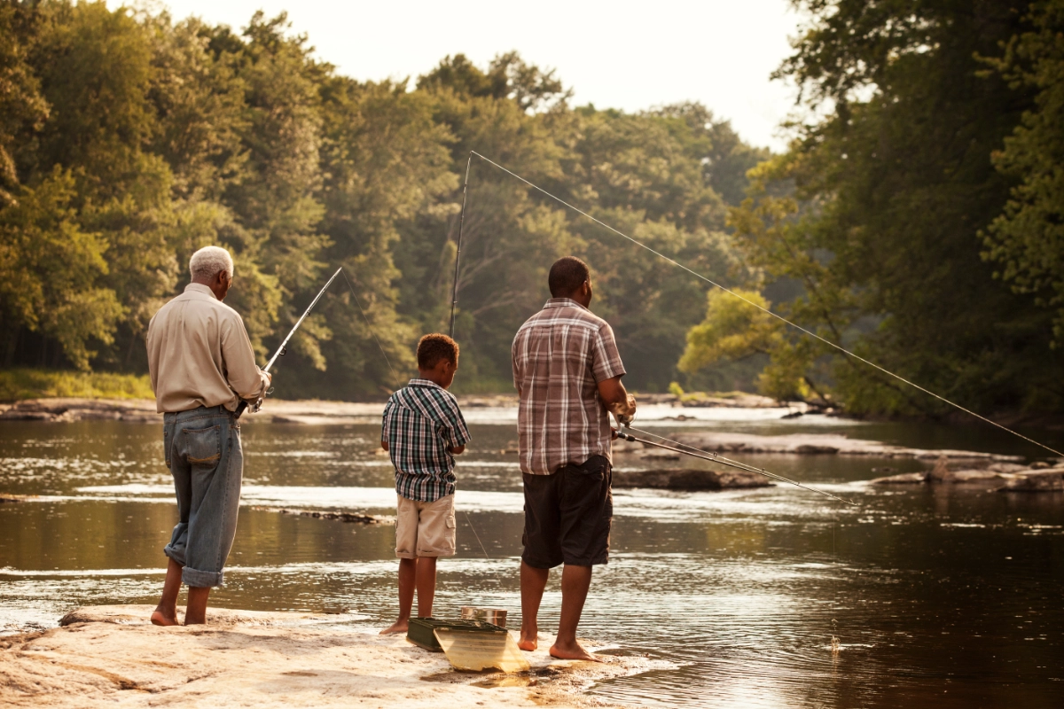 Grandfather, father, and son fishing together