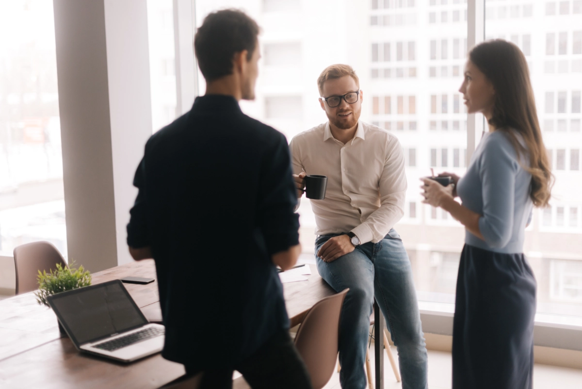 Three business people talking in an office
