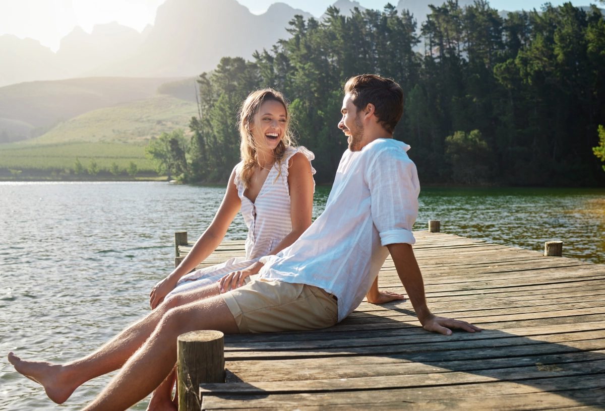 Young Couple Sitting on Pier